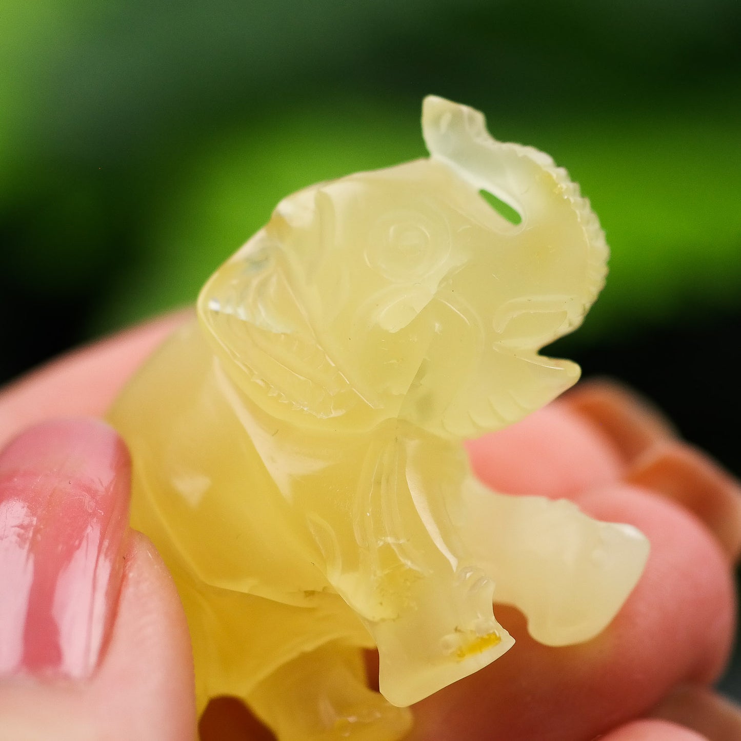 Hand carved elephant figurine from natural Baltic amber