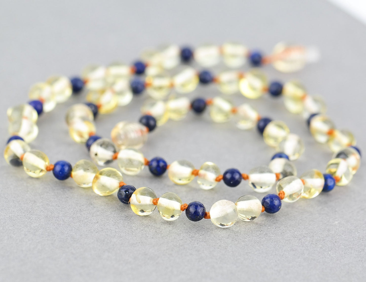 Amber kids necklace with blue amethyst