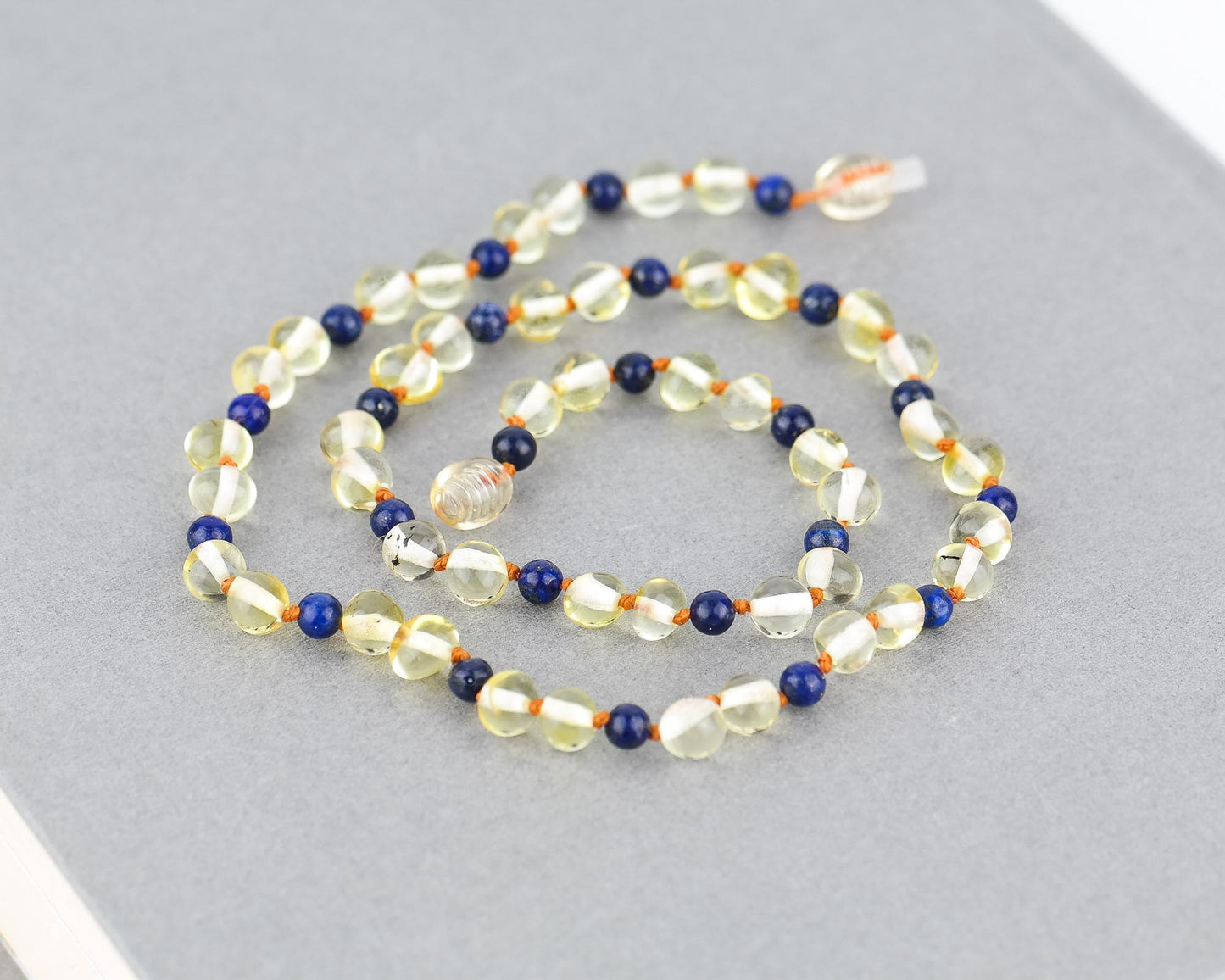 Amber kids necklace with blue amethyst