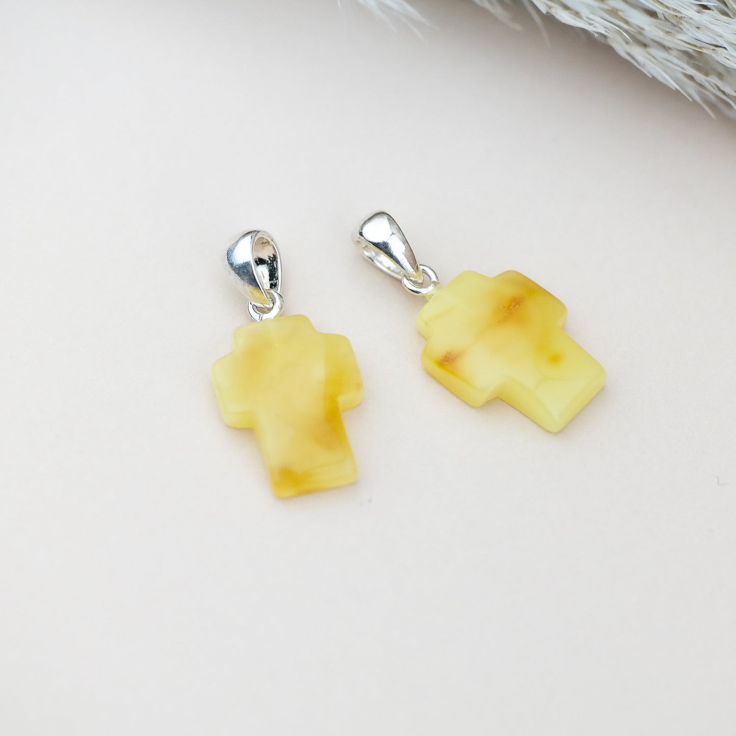 Butterscotch cross pendants for couple