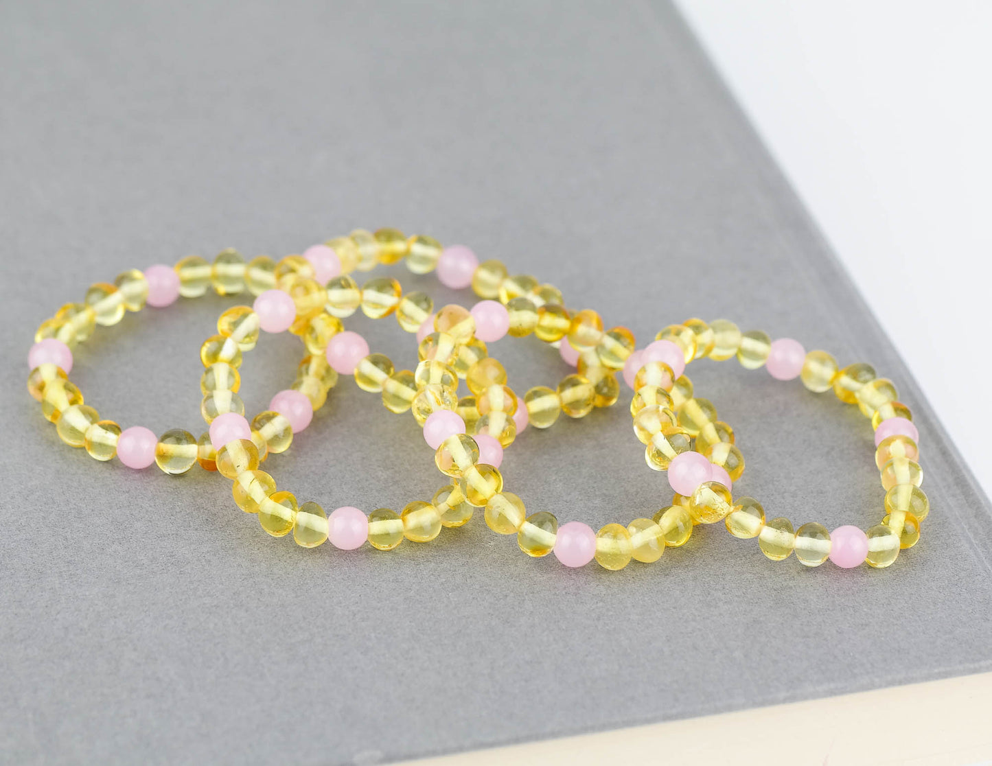 Kids amber bracelets with rose quartz beads