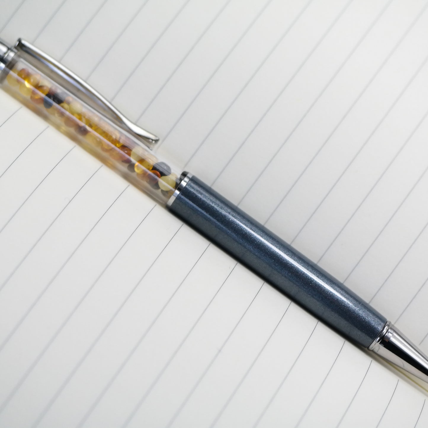 Colourful pen with natural Baltic amber