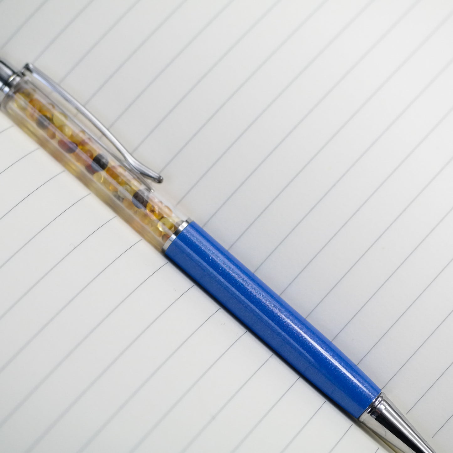 Colourful pen with natural Baltic amber