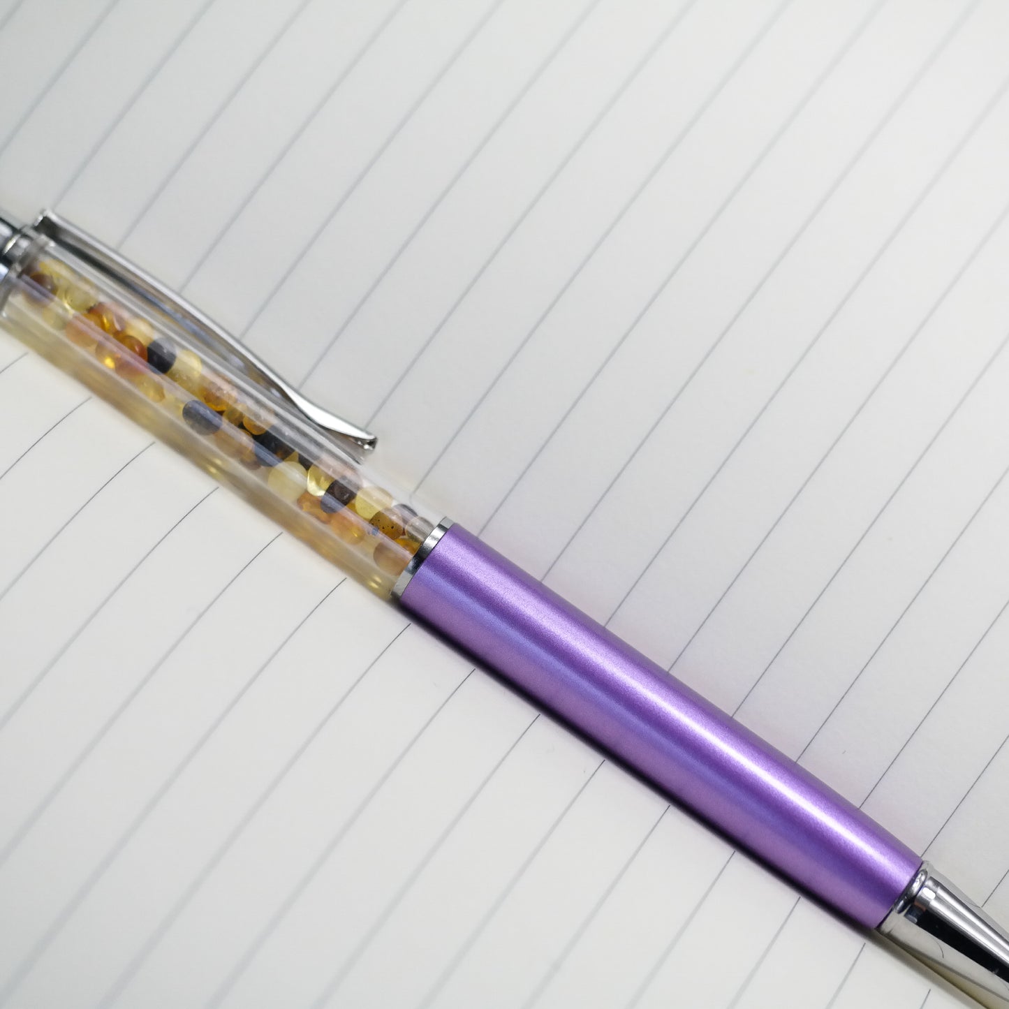 Colourful pen with natural Baltic amber