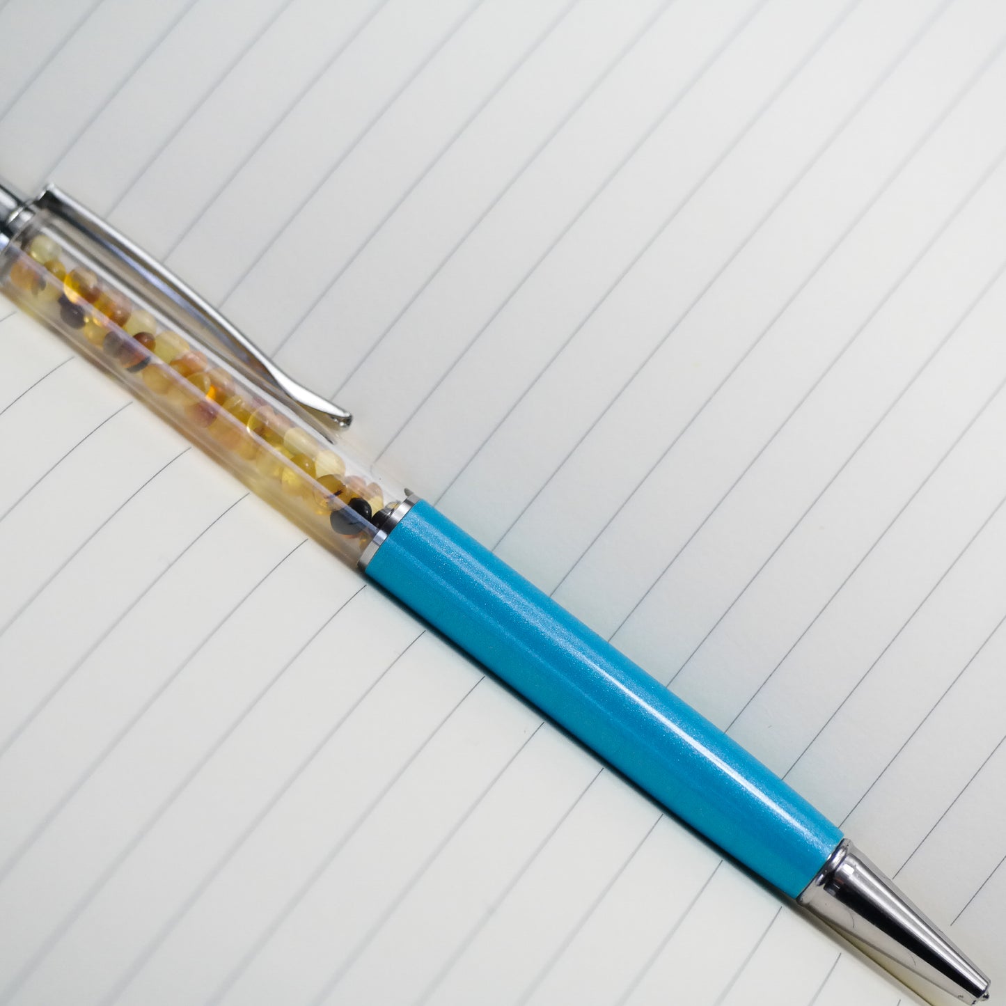 Colourful pen with natural Baltic amber