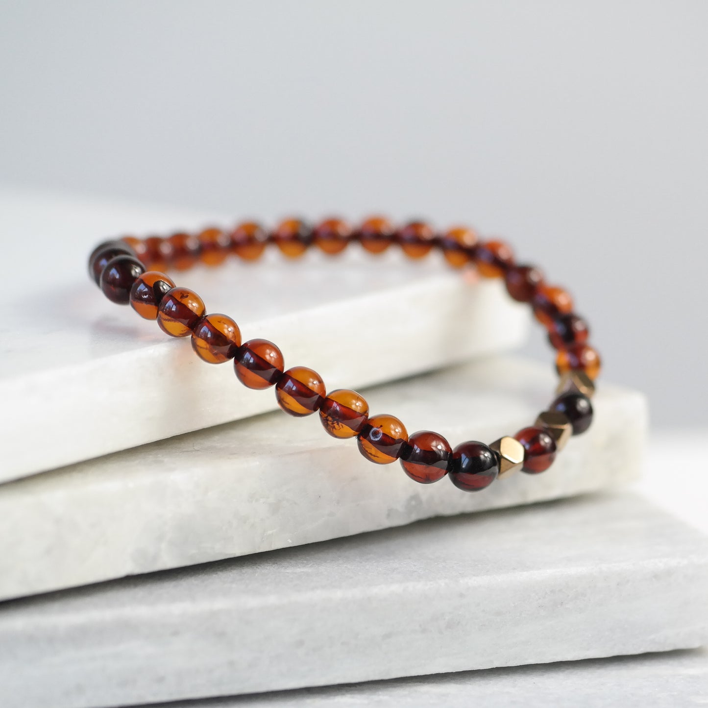 Chic natural Baltic amber bracelet with metal details