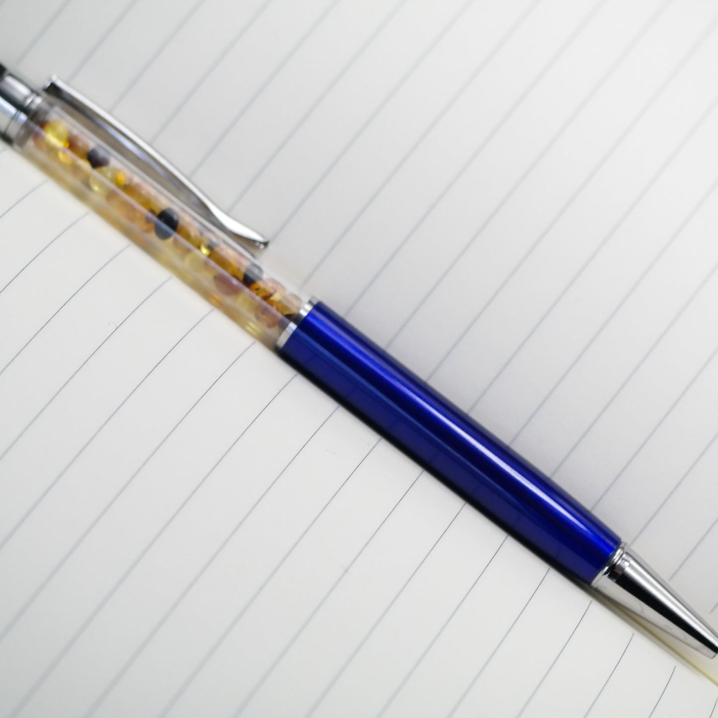 Colourful pen with natural Baltic amber