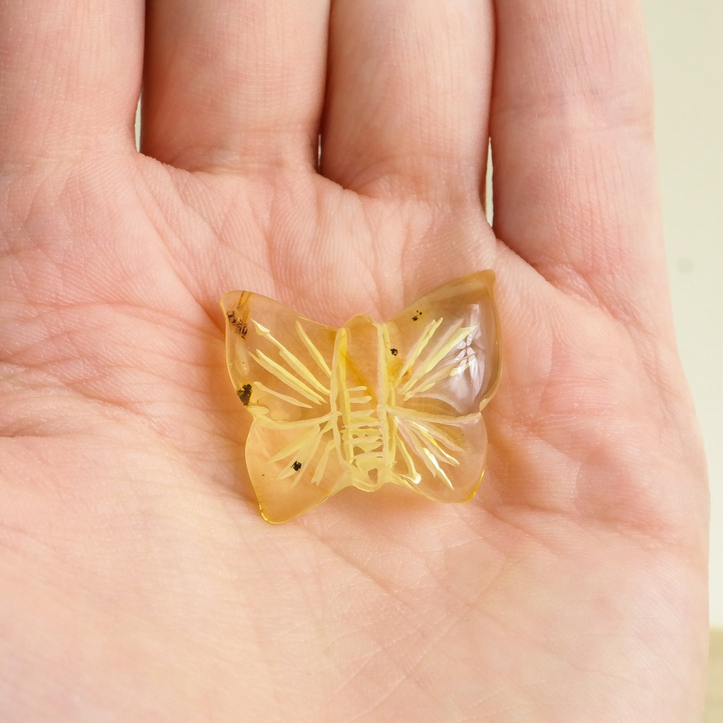 Hand carved butterfly figurines from natural Baltic amber