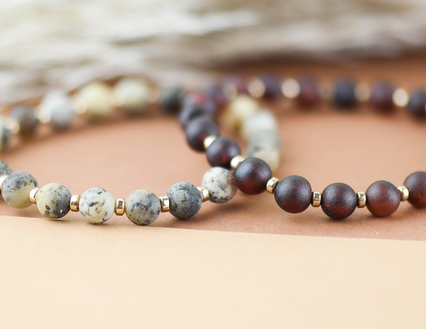 Handmade amber bracelet with gold colour hematite details