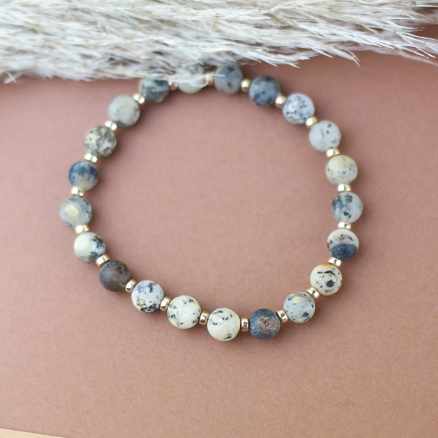 Handmade amber bracelet with gold colour hematite details