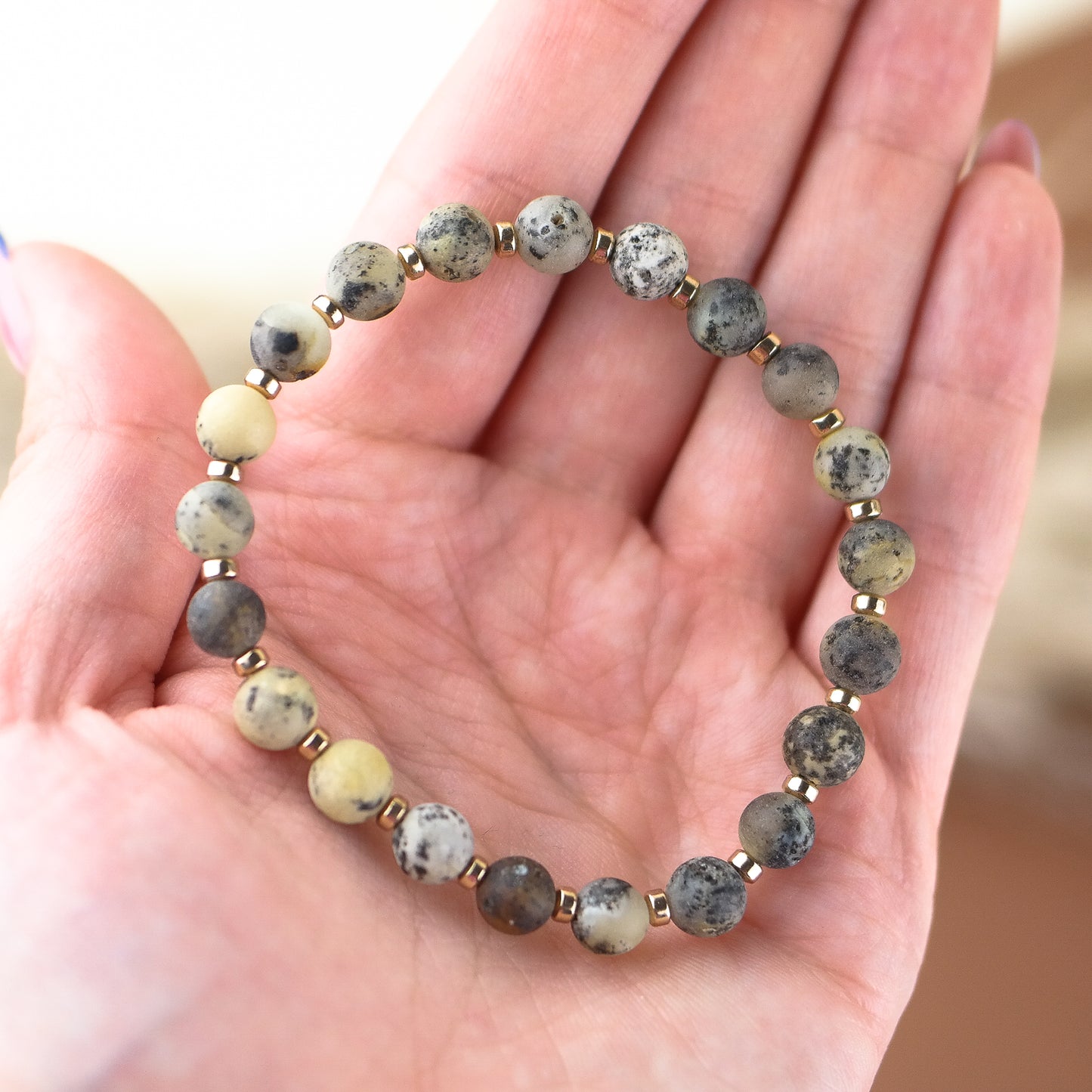 Handmade amber bracelet with gold colour hematite details