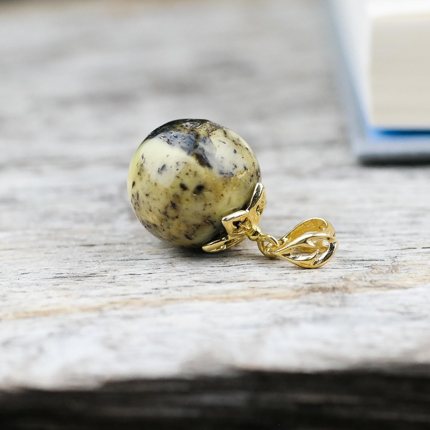 Handmade pendant, gold plated with natural Baltic amber bead
