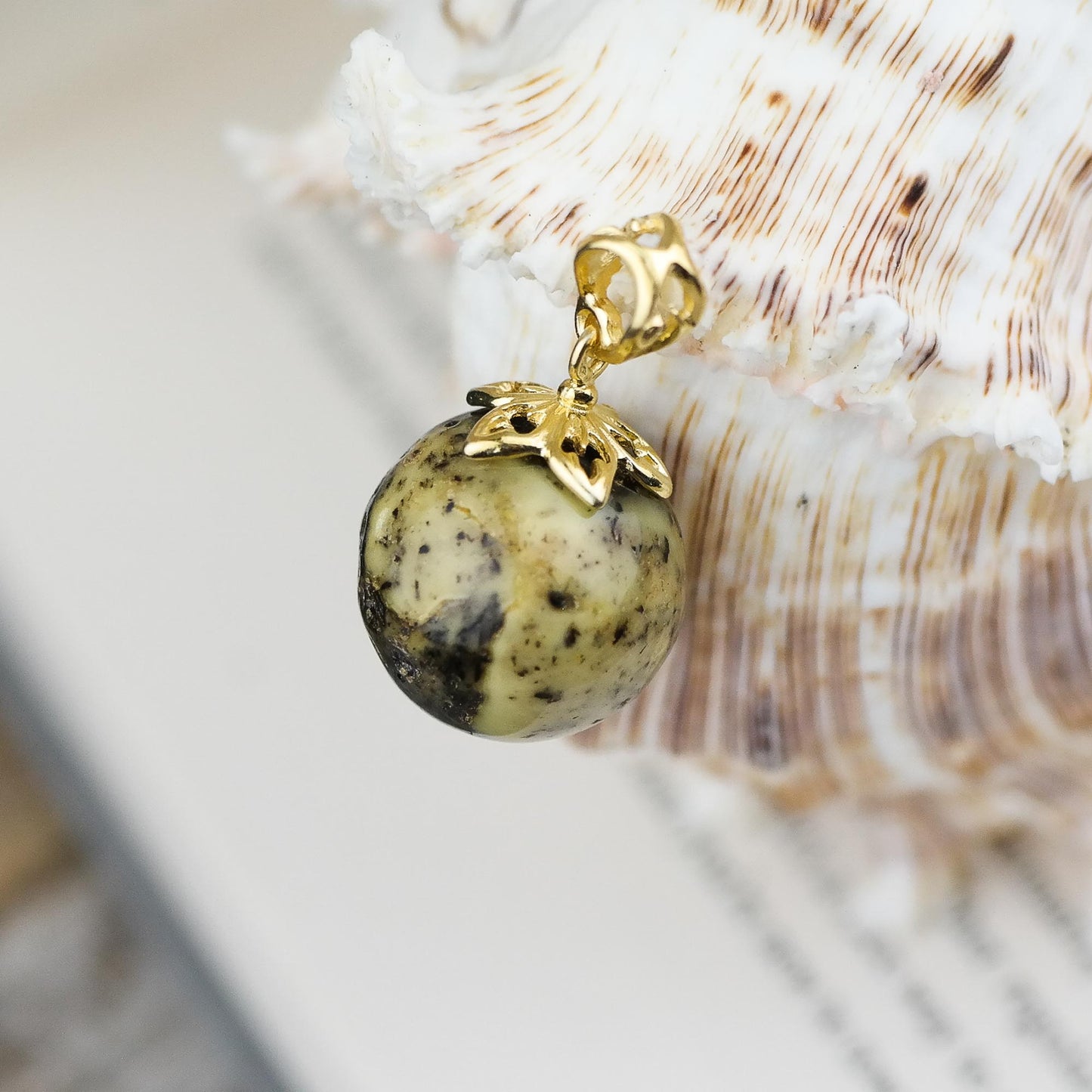 Handmade pendant, gold plated with natural Baltic amber bead