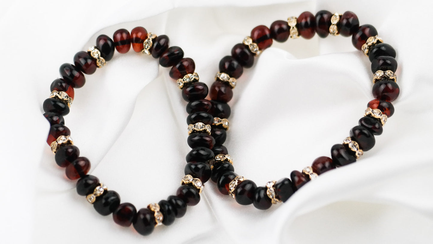 Cherry amber bracelets with gold colour spacers