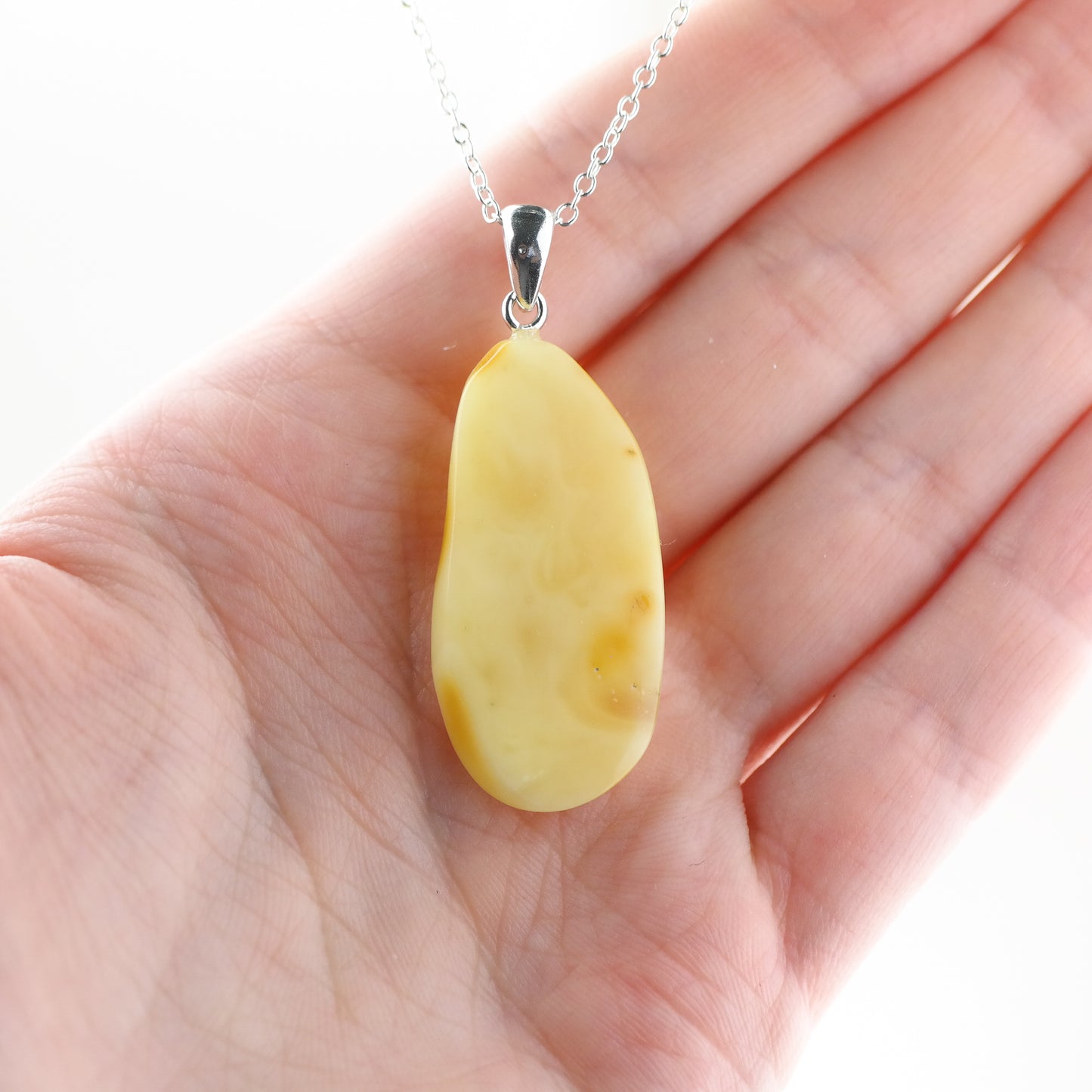Handmade pendant from butterscotch amber