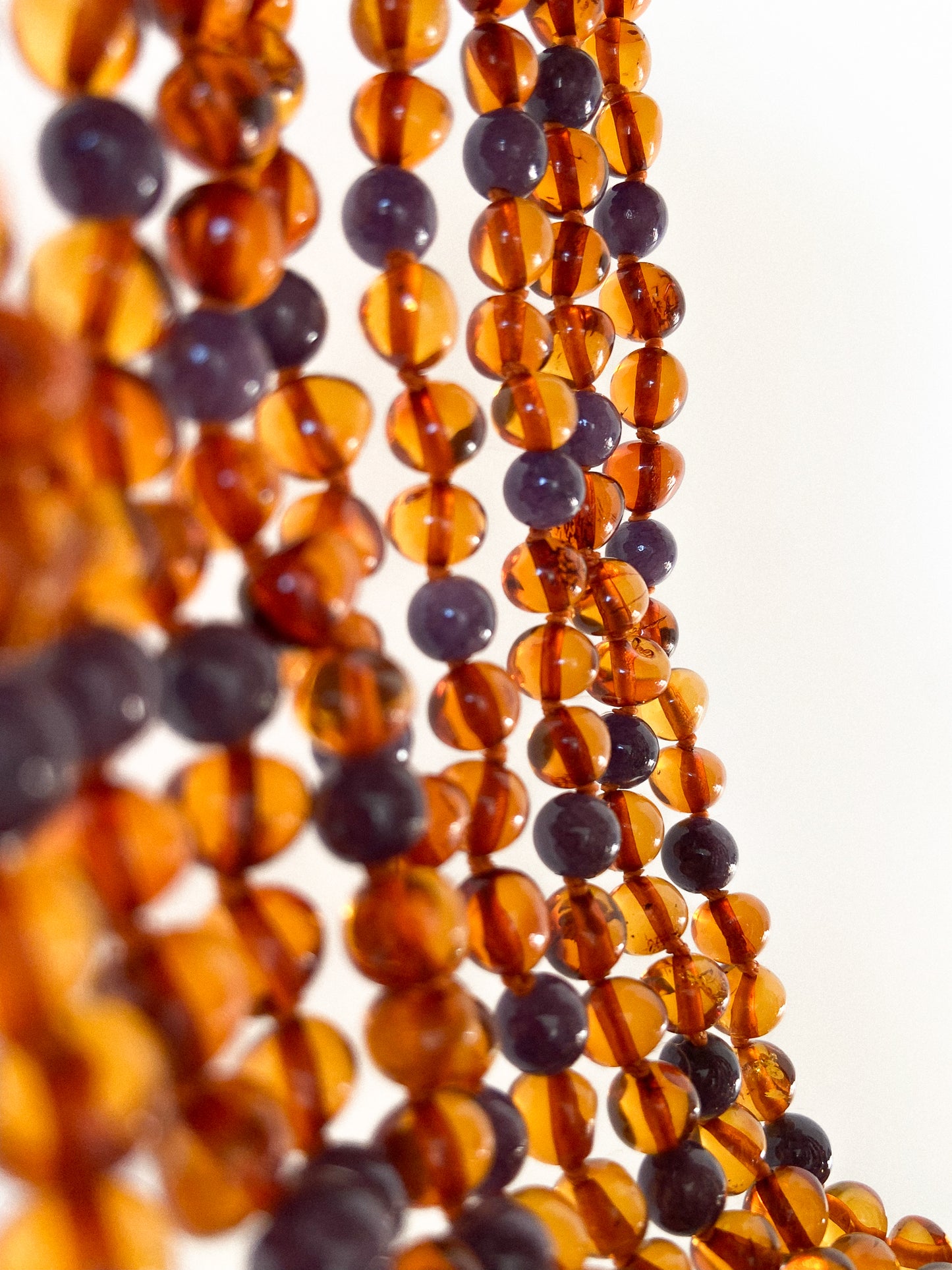 Amber necklaces with amethyst