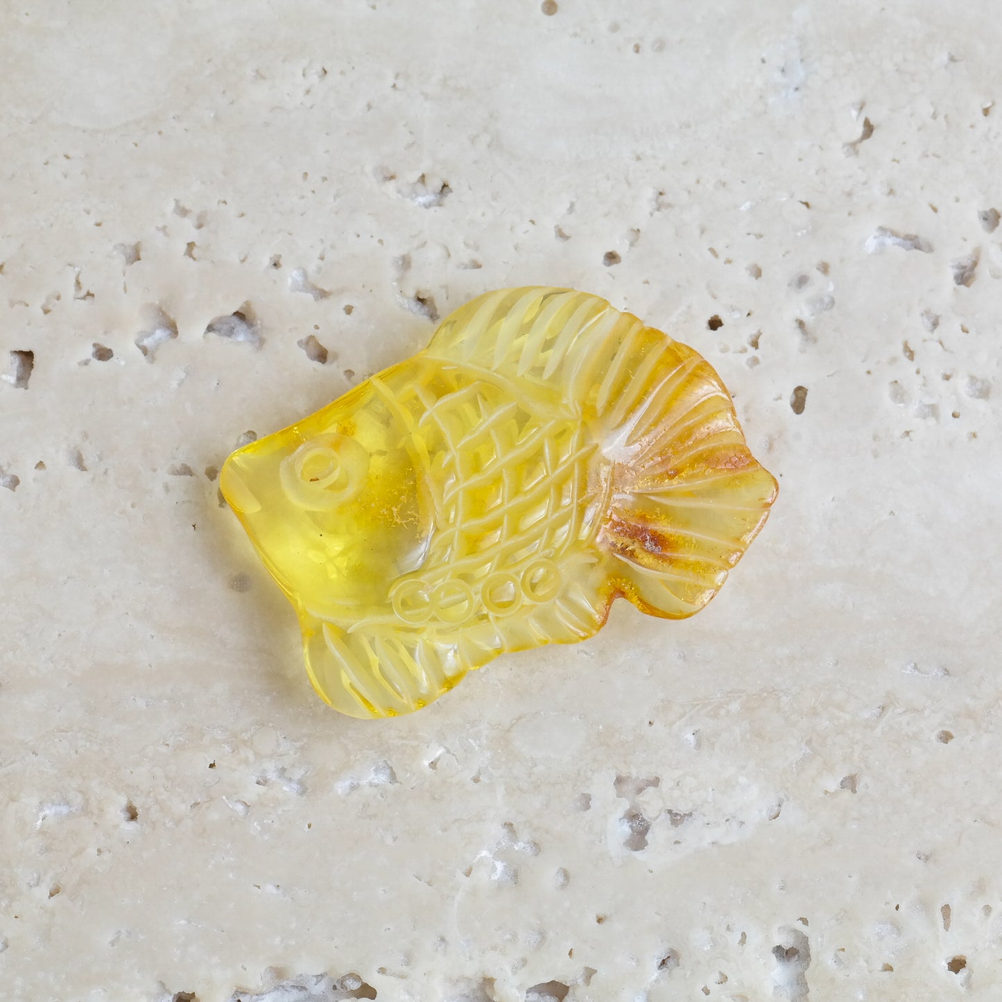 Hand carved fish figurine from natural Baltic amber