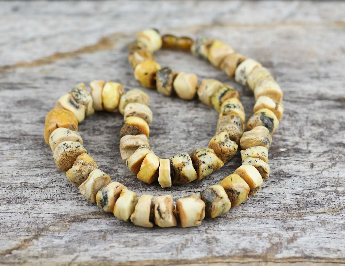 Sea sediment, tube shaped amber bead necklace