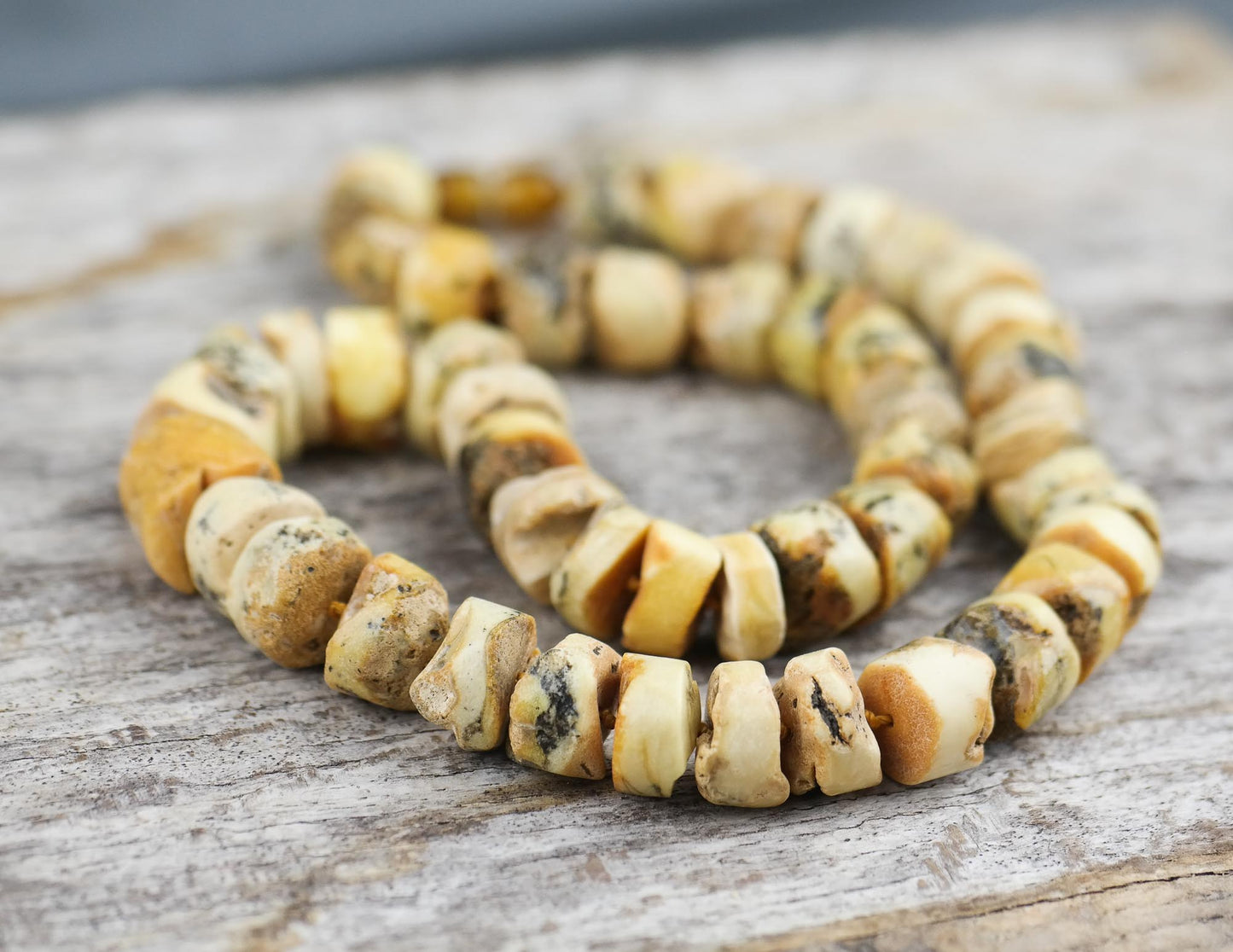 Sea sediment, tube shaped amber bead necklace