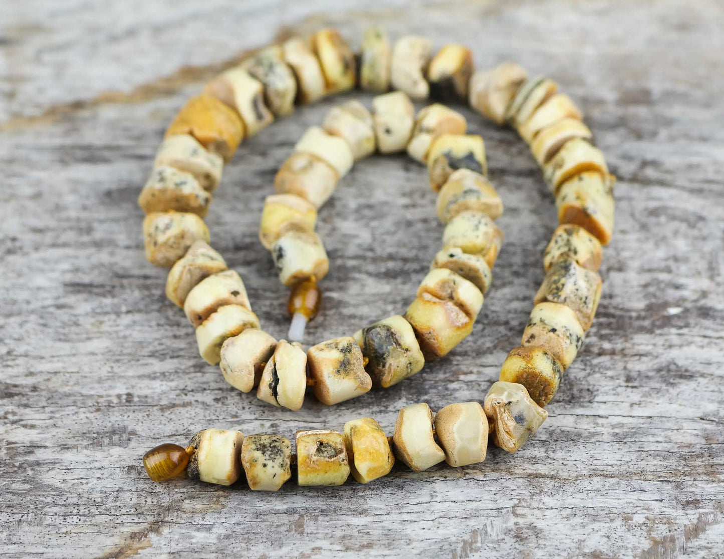Sea sediment, tube shaped amber bead necklace