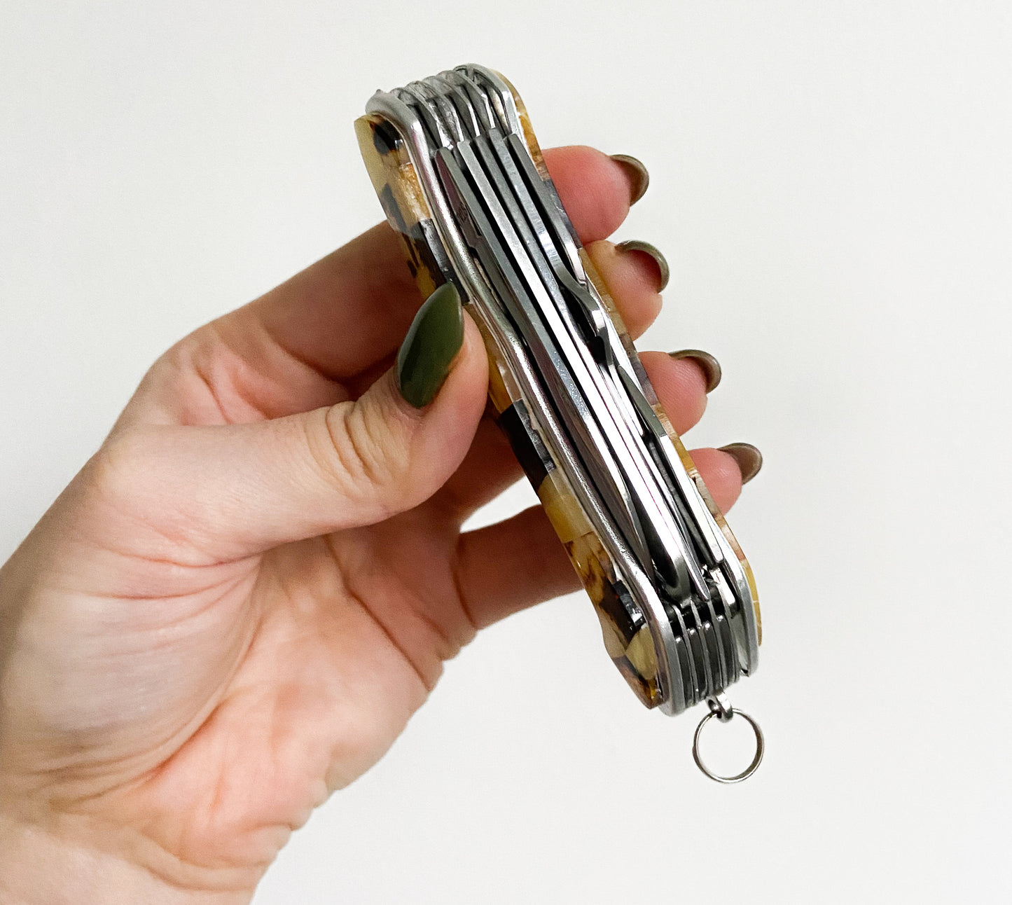 Multi tool pocket knife with natural Baltic amber mosaic