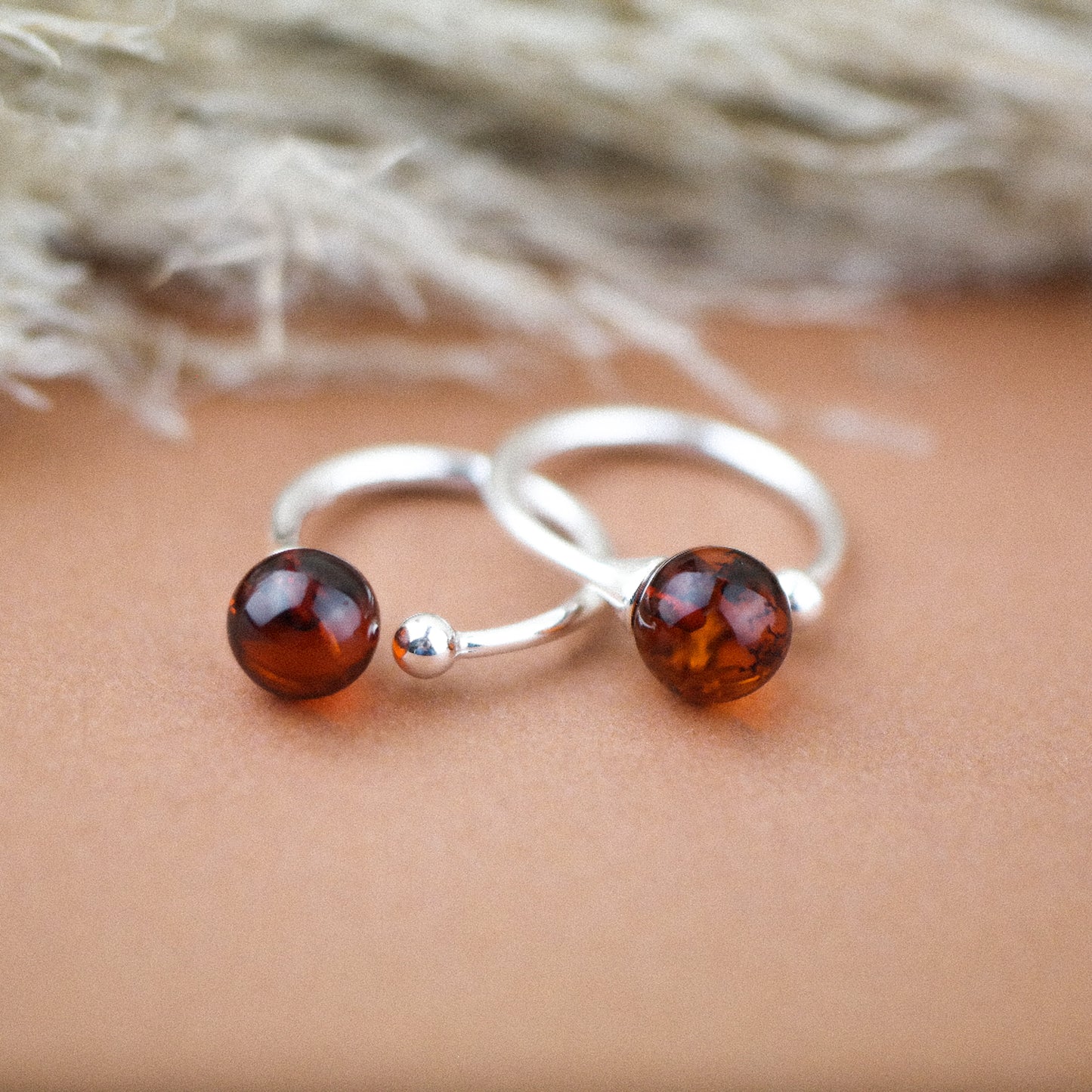Silver ring with natural amber bead