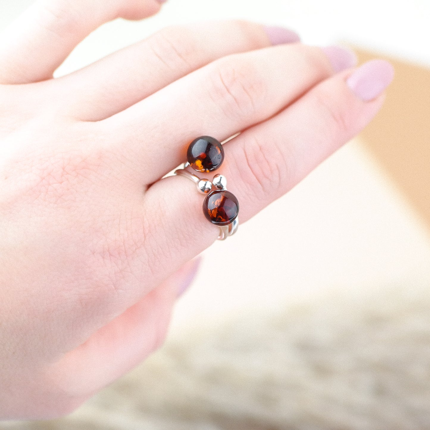 Silver ring with natural amber bead