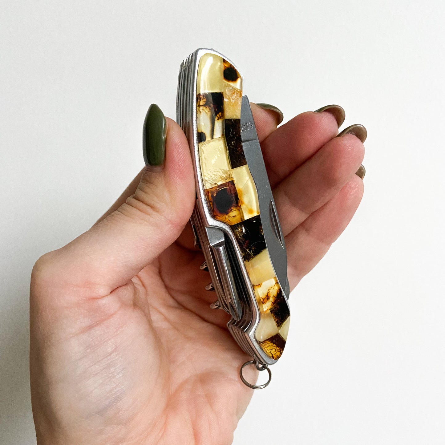 Multi tool pocket knife with natural Baltic amber mosaic