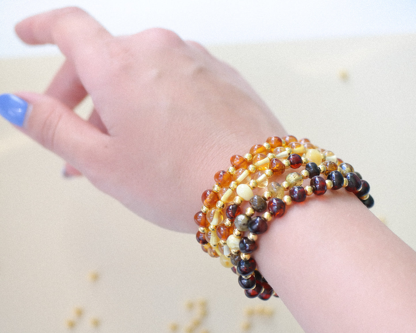 Chic amber bracelets with gold colour spacers