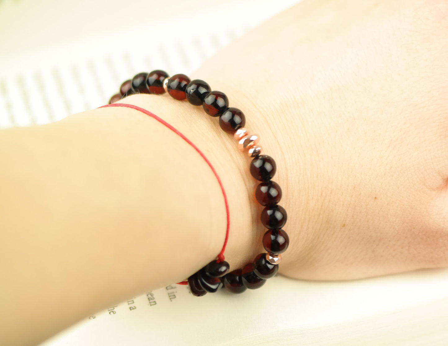 Stylish natural Baltic amber bracelet with rose gold colour details