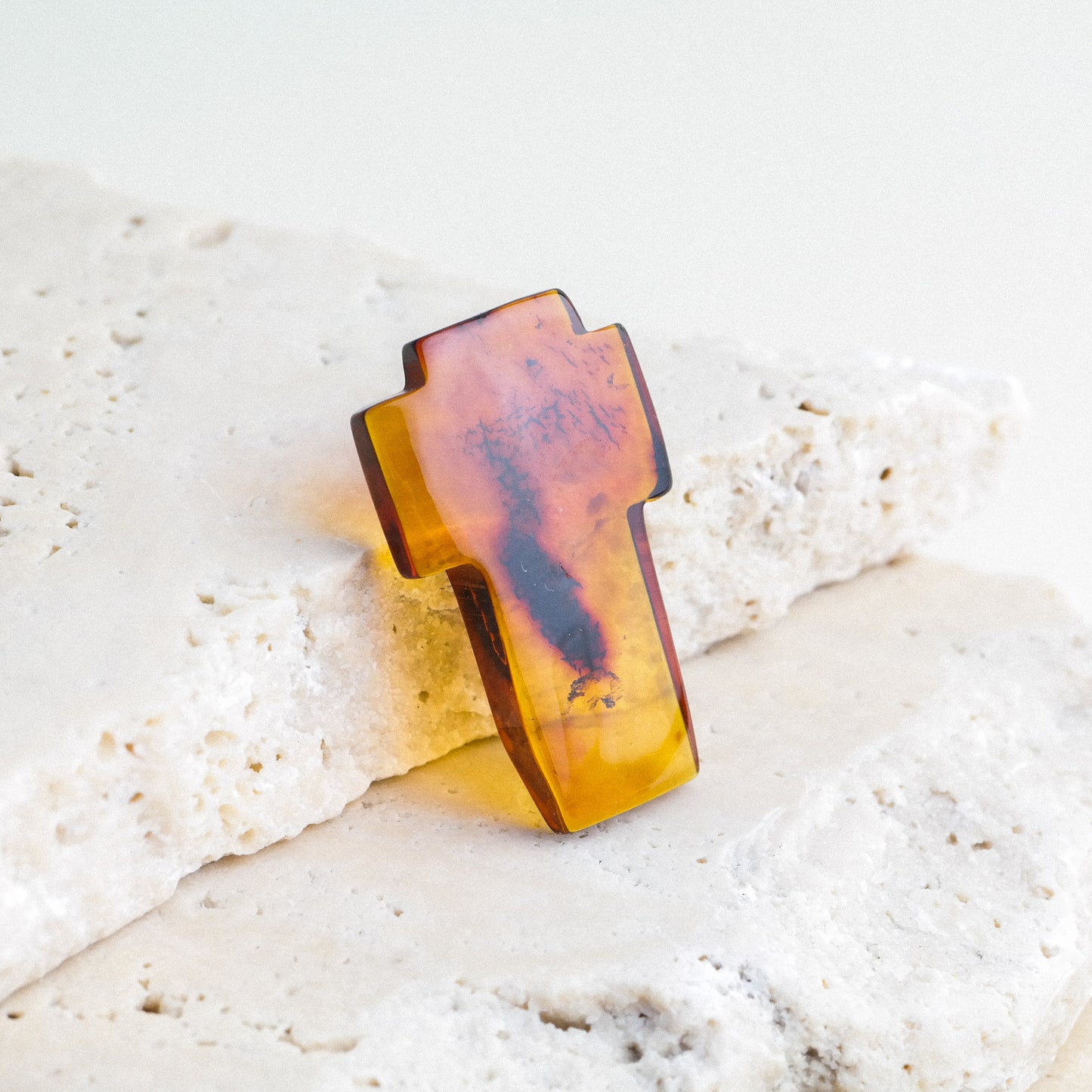 Hand carved crosses from natural Baltic amber