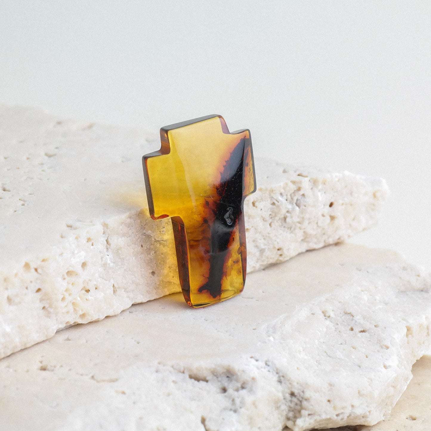 Hand carved crosses from natural Baltic amber