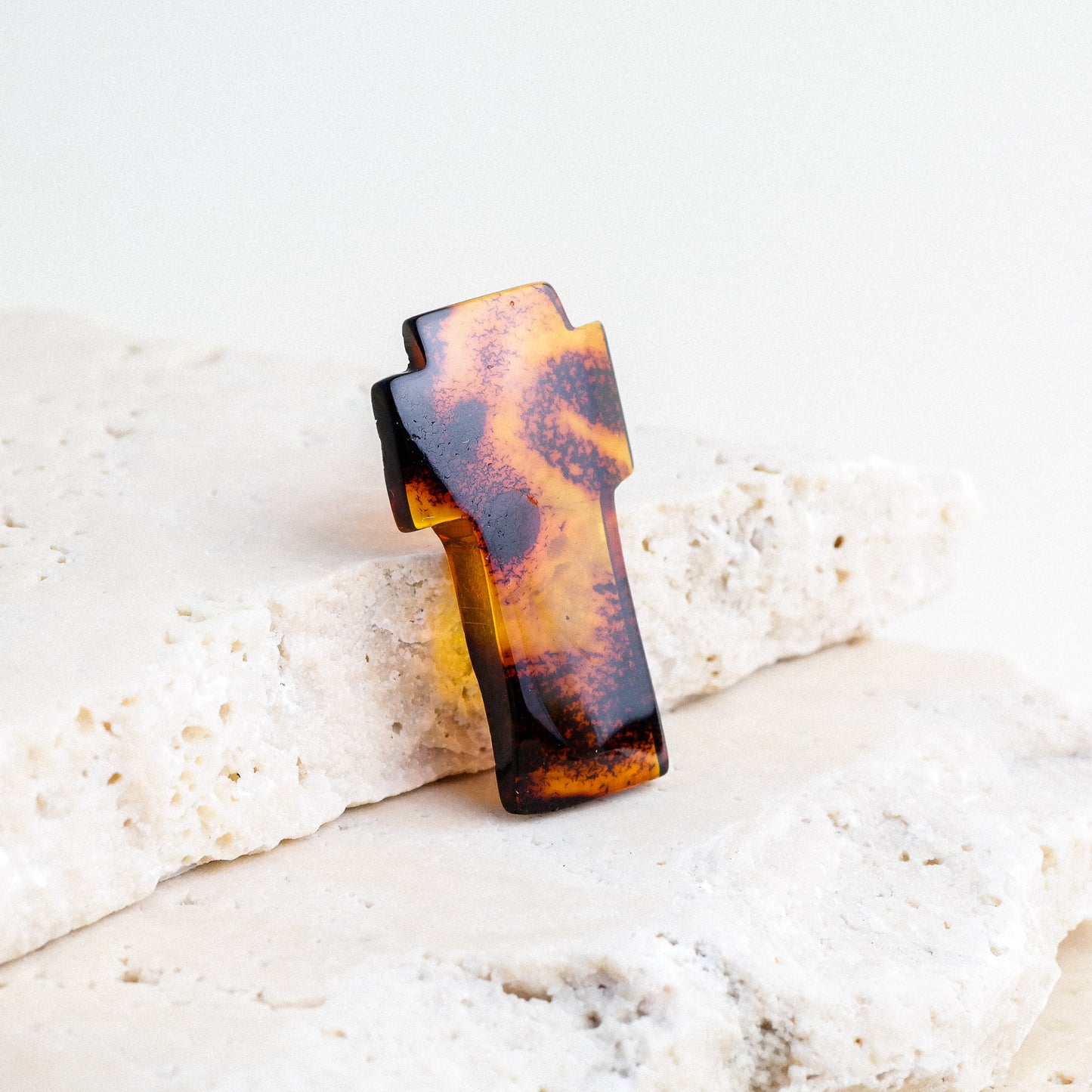 Hand carved crosses from natural Baltic amber