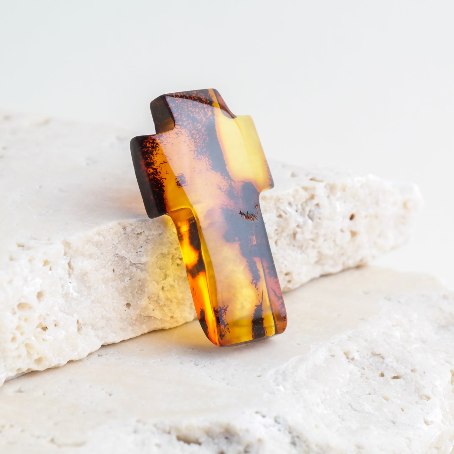 Hand carved crosses from natural Baltic amber