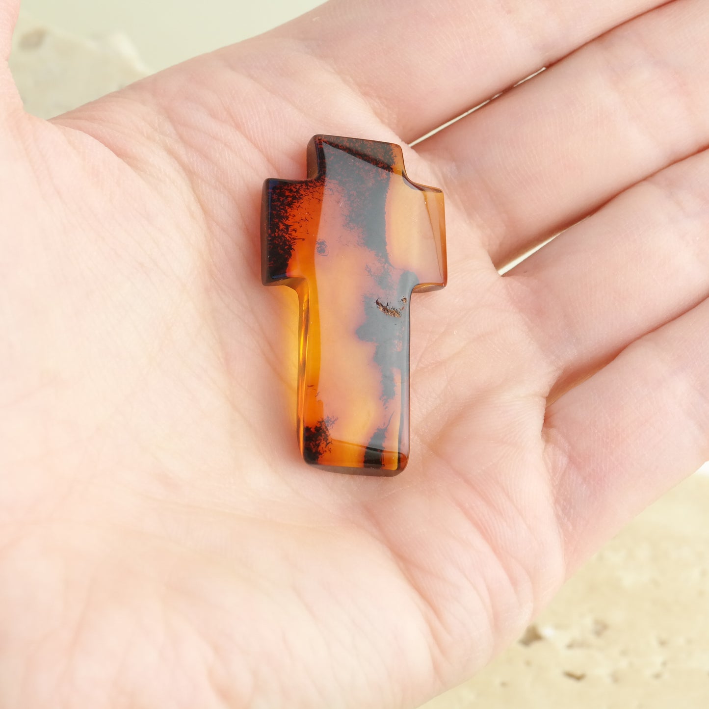 Hand carved crosses from natural Baltic amber