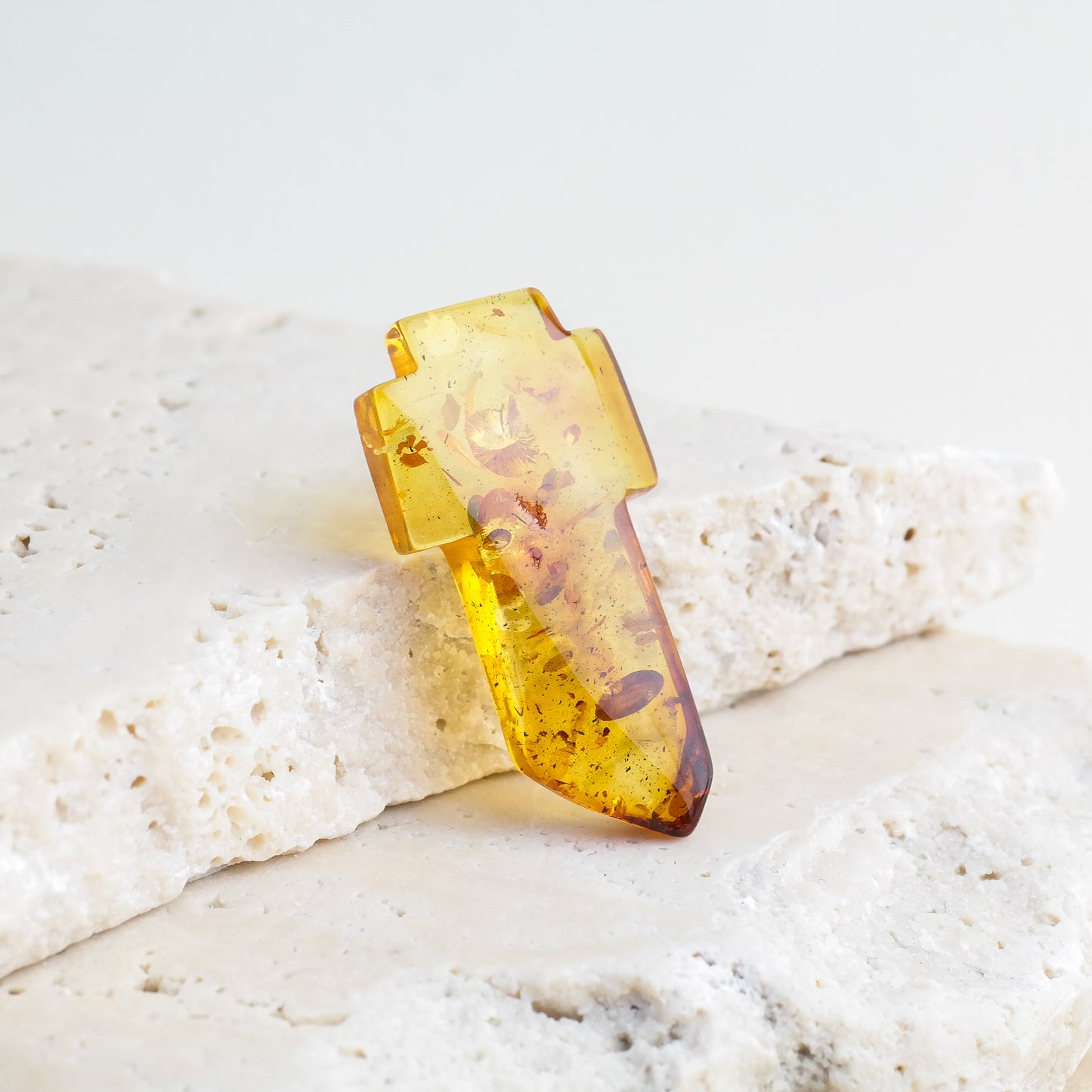 Beautiful hand carved crosses from natural Baltic amber