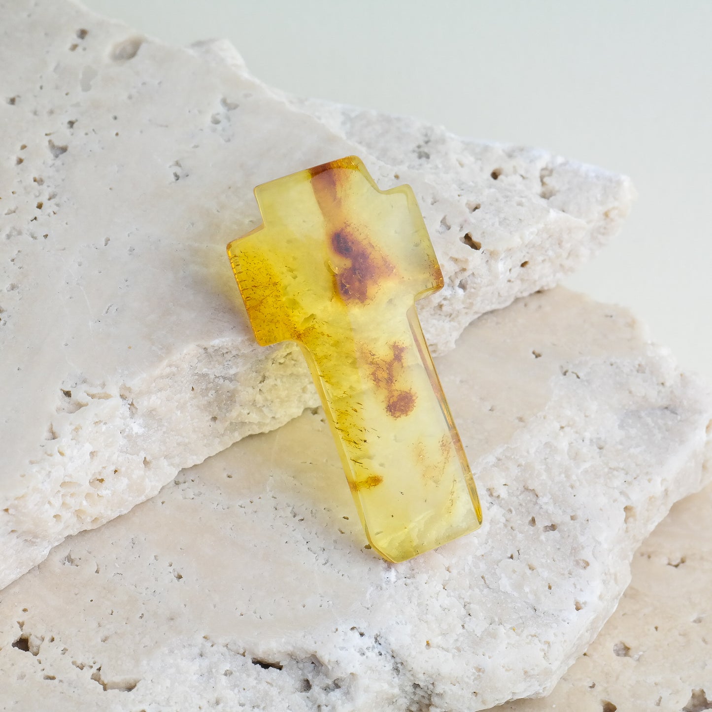 Beautiful hand carved crosses from natural Baltic amber