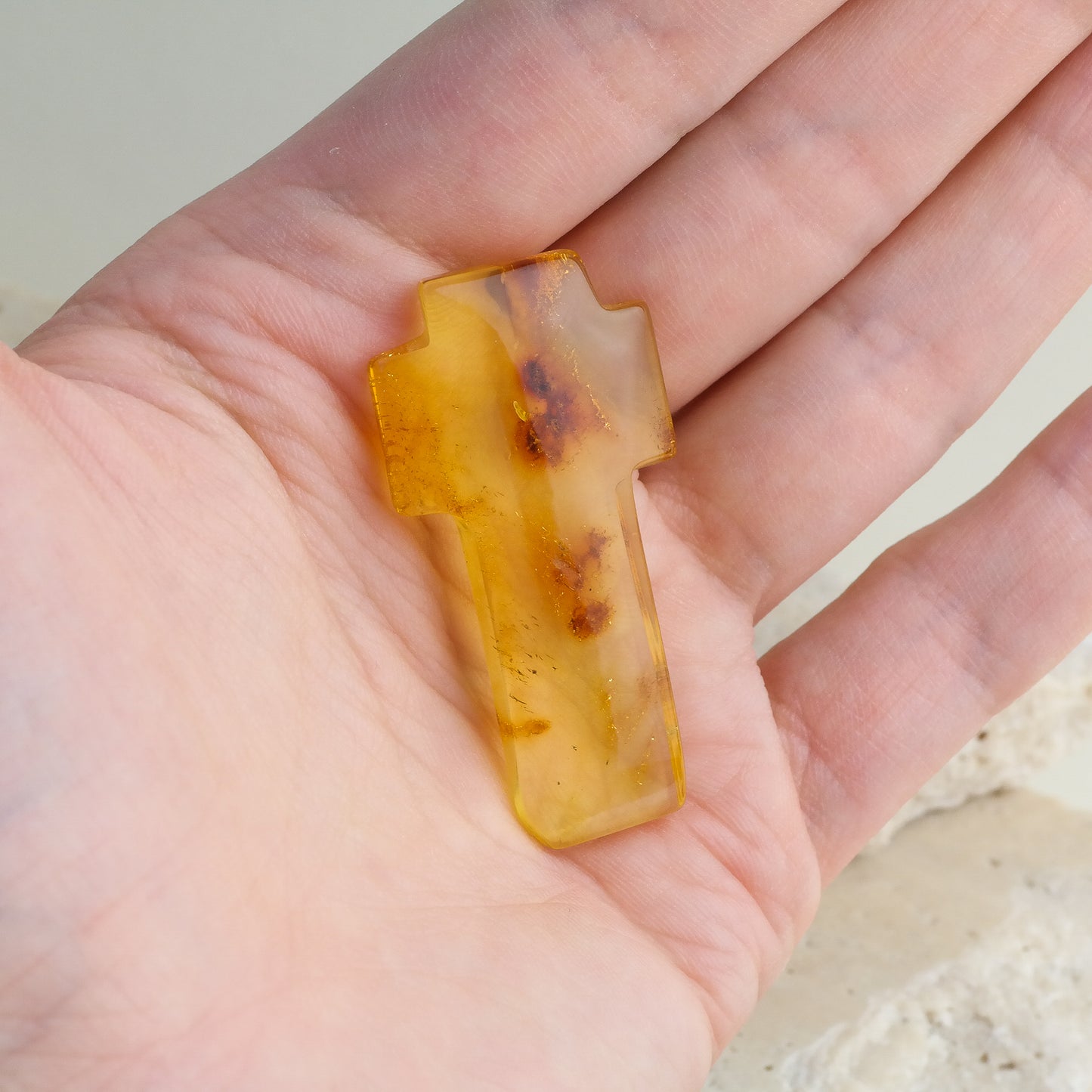 Beautiful hand carved crosses from natural Baltic amber