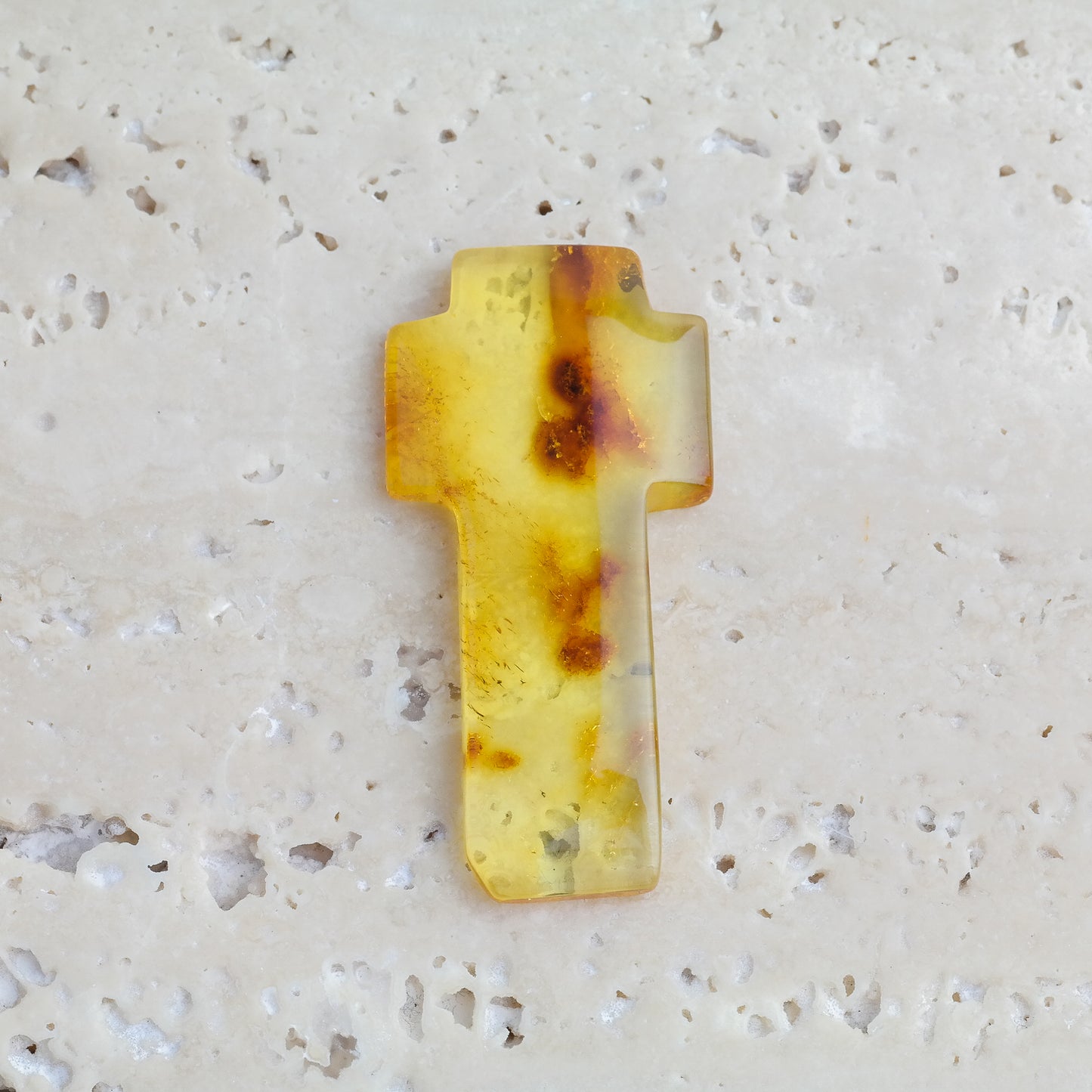 Beautiful hand carved crosses from natural Baltic amber