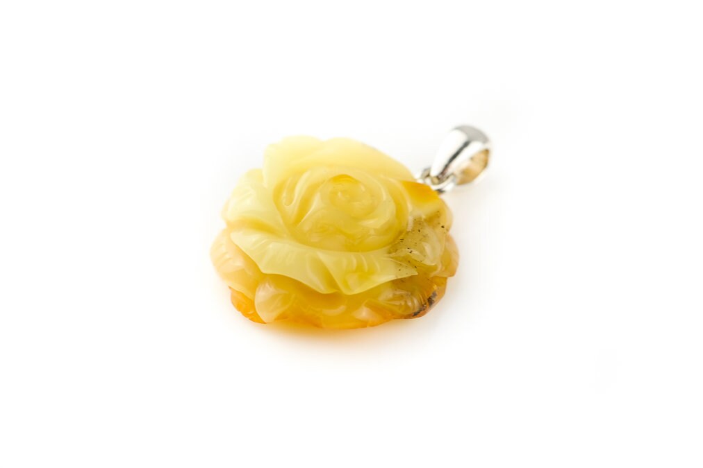 Hand carved rose pendant