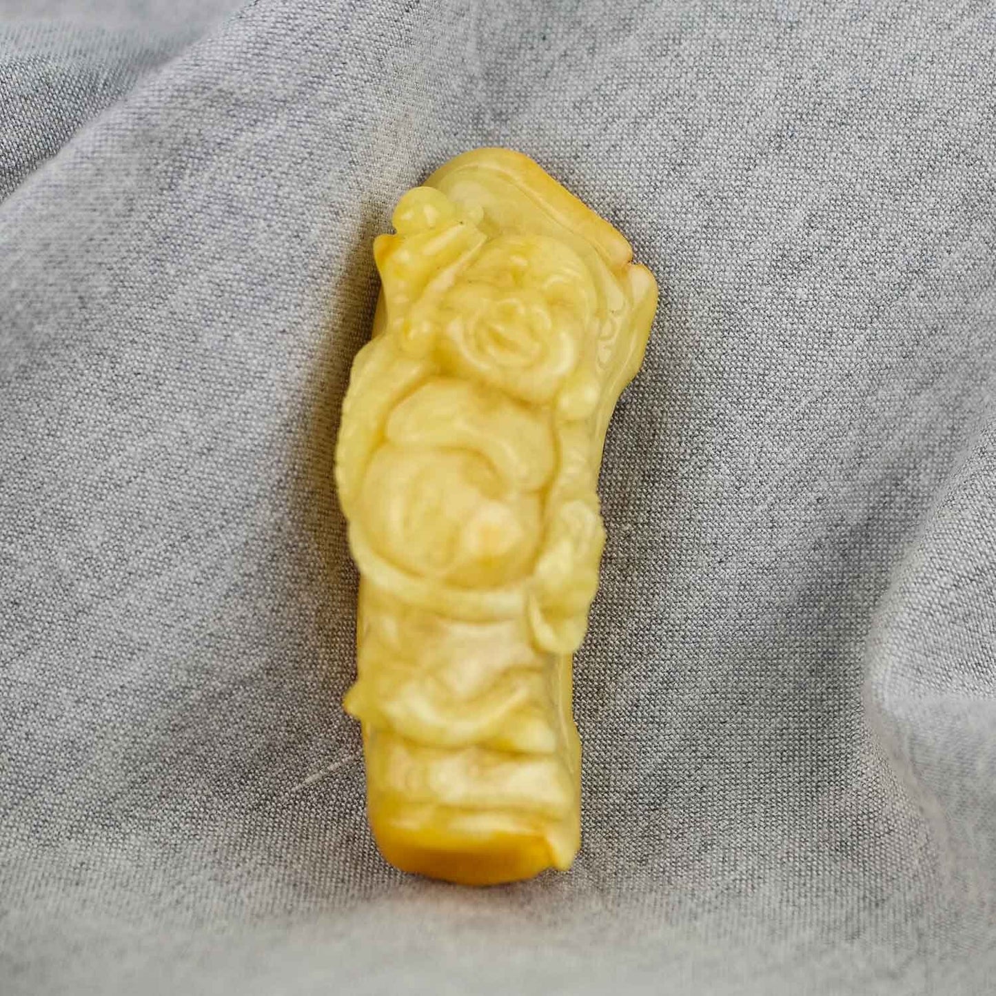 Hand carved amber buddha