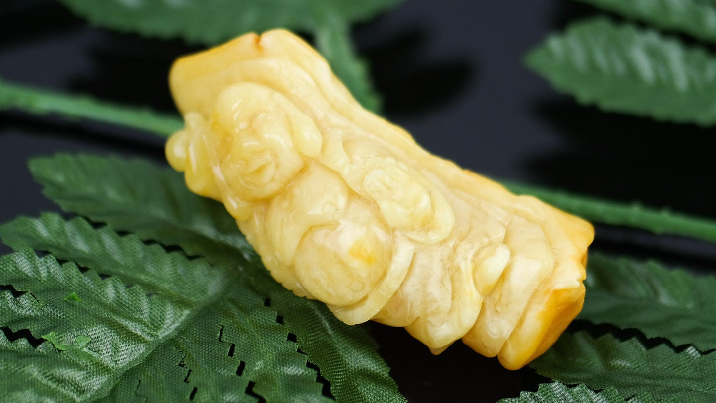 Hand carved amber buddha