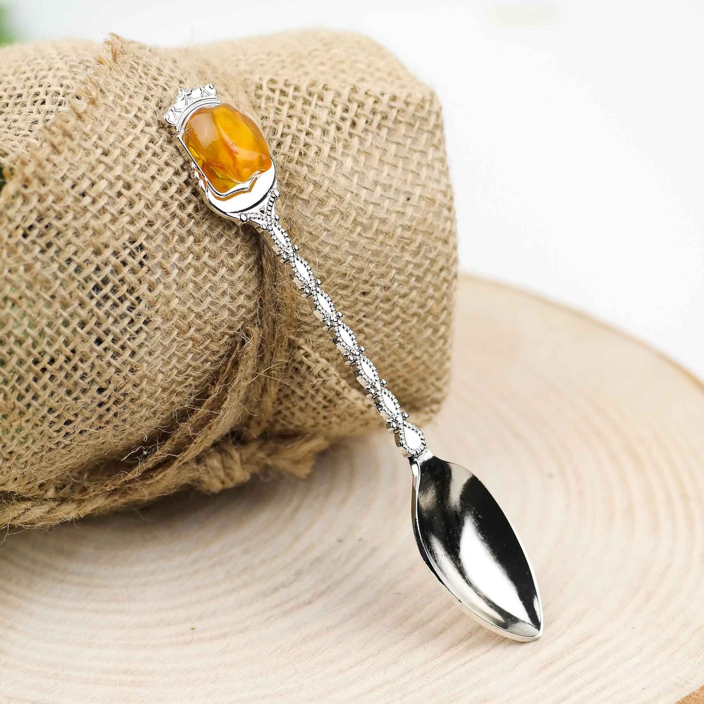 Tea spoon with natural Baltic amber stone