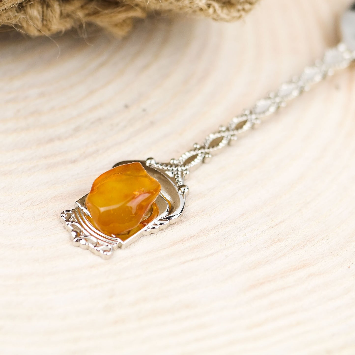 Tea spoon with natural Baltic amber stone