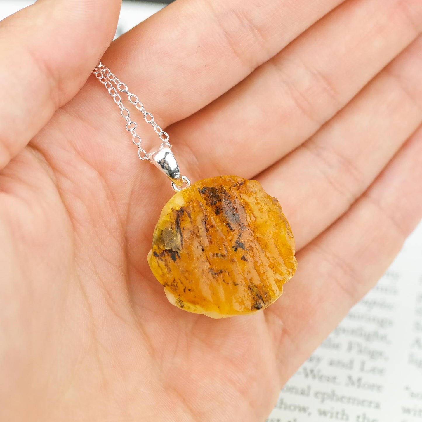 Natural amber hand carved pendants