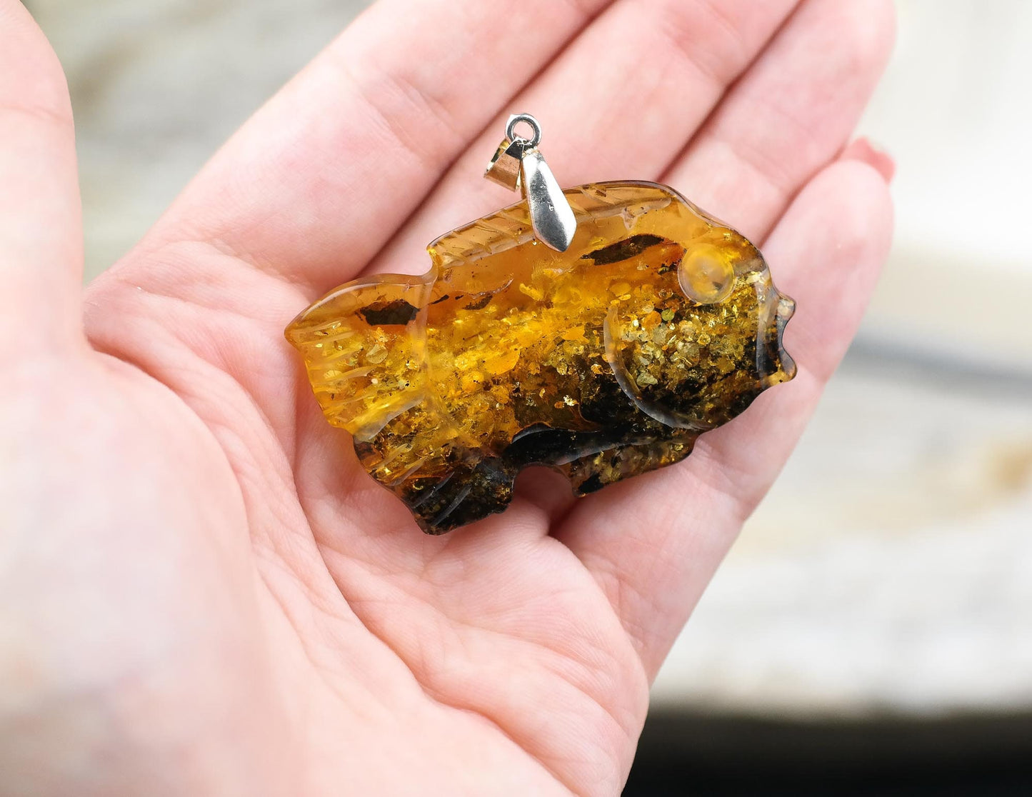 Hand carved fish pendant