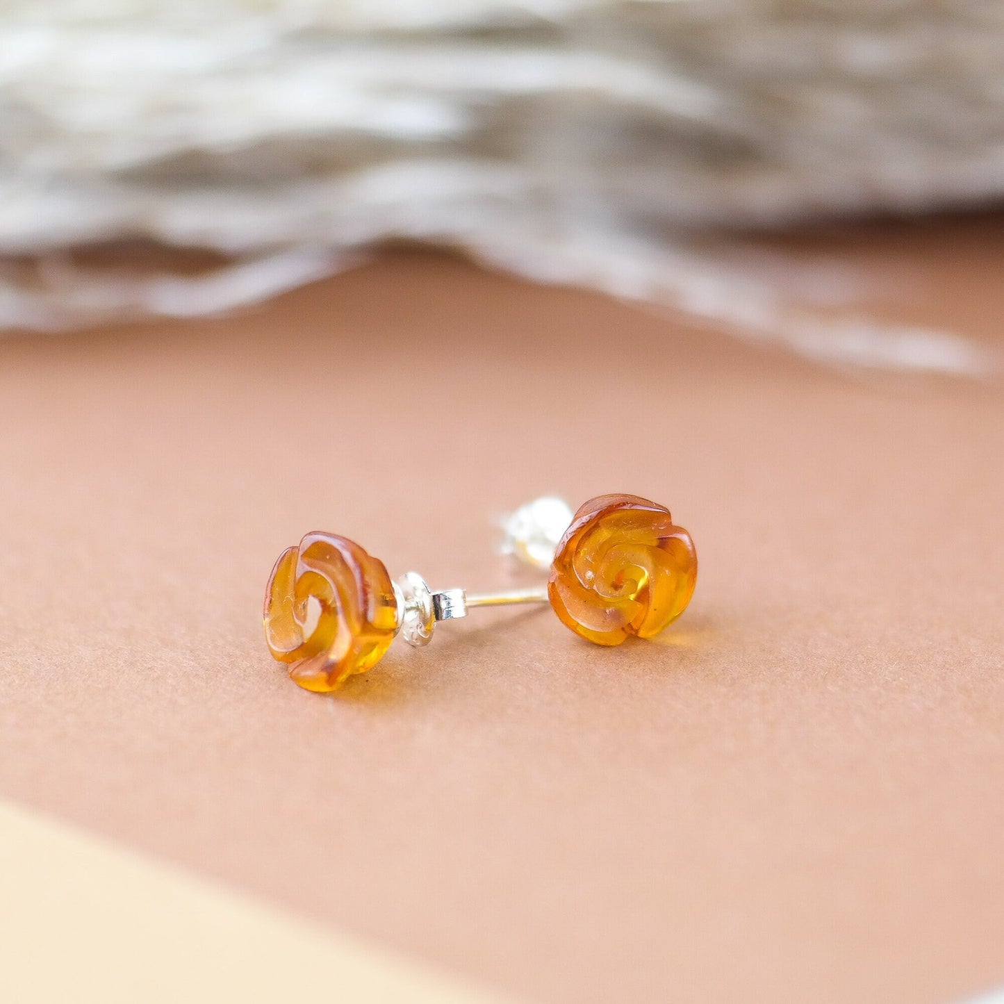 Stud silver earrings with hand carved roses