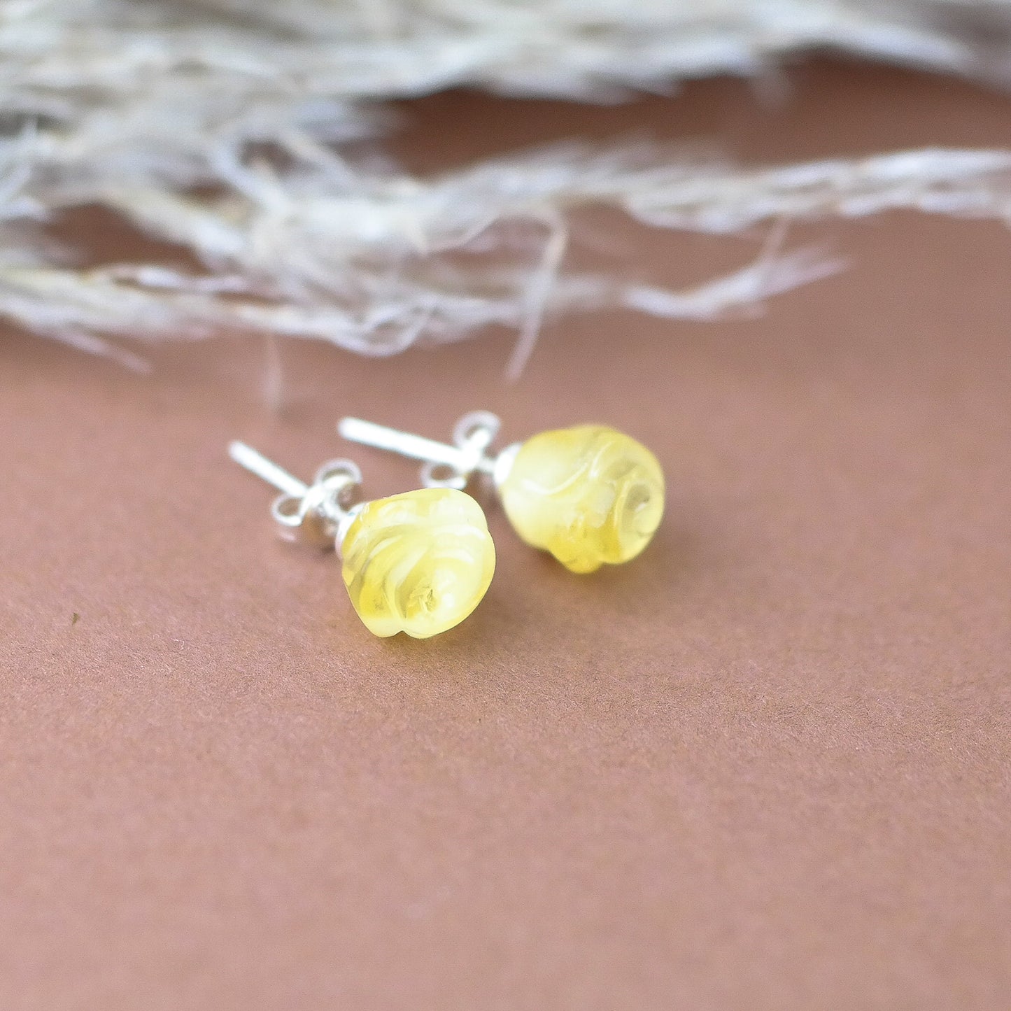 Stud silver earrings with hand carved roses