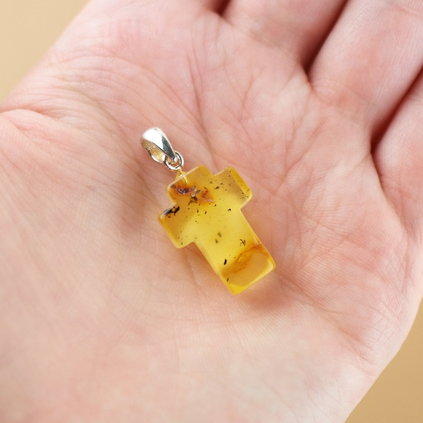 Amber cross pendant