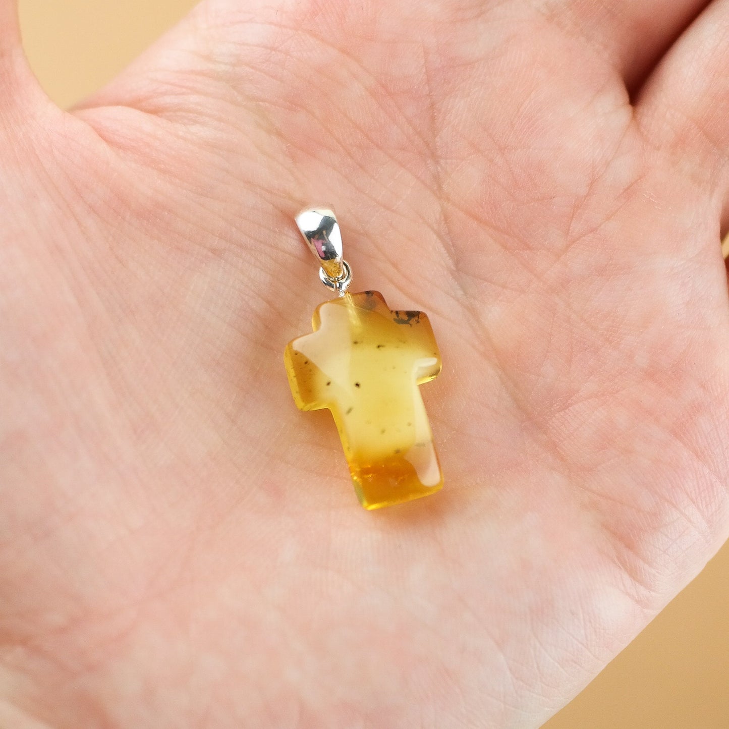 Amber cross pendant